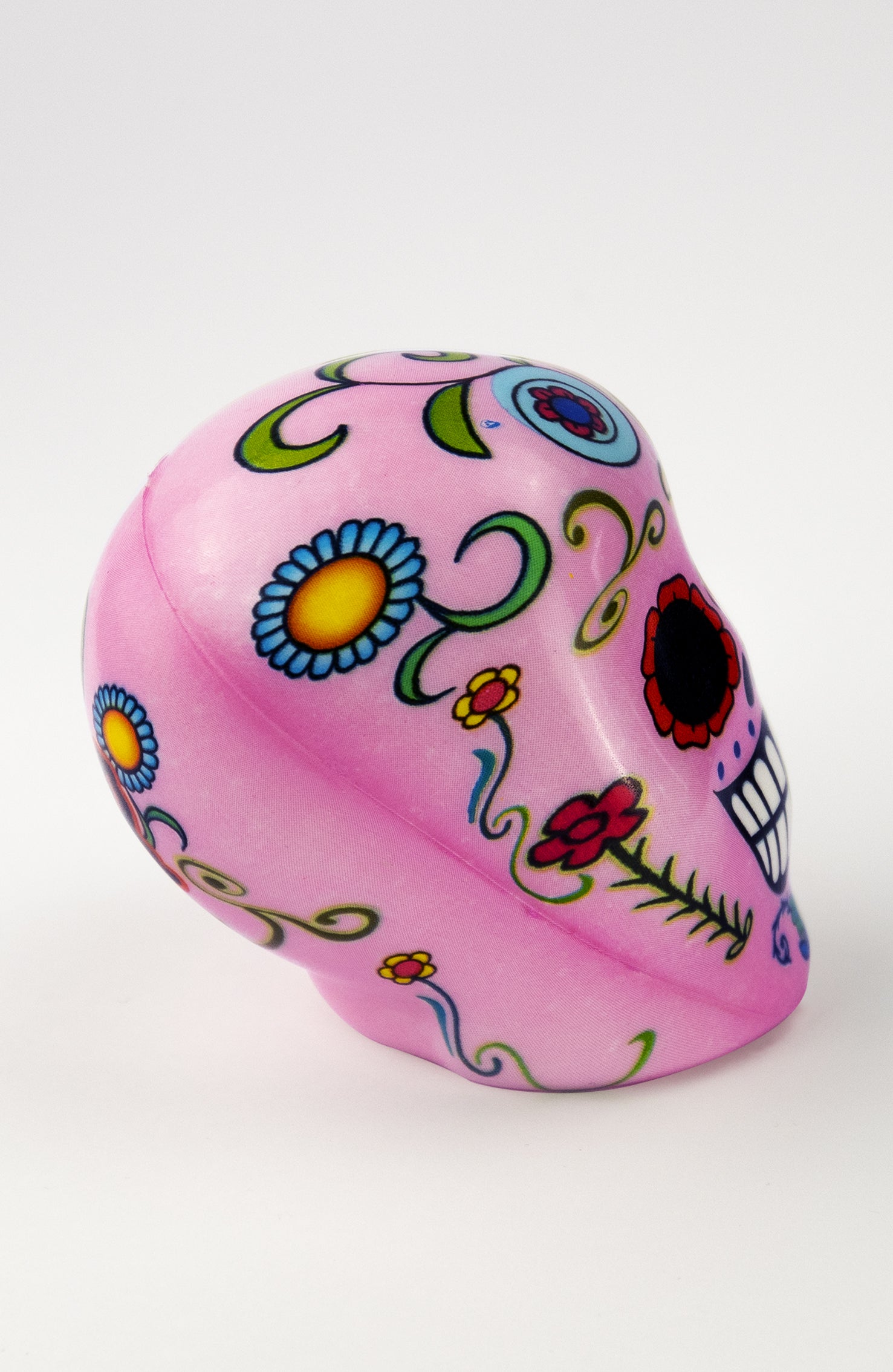 Pallina Antistress a forma di teschio rosa con decorazioni floreali