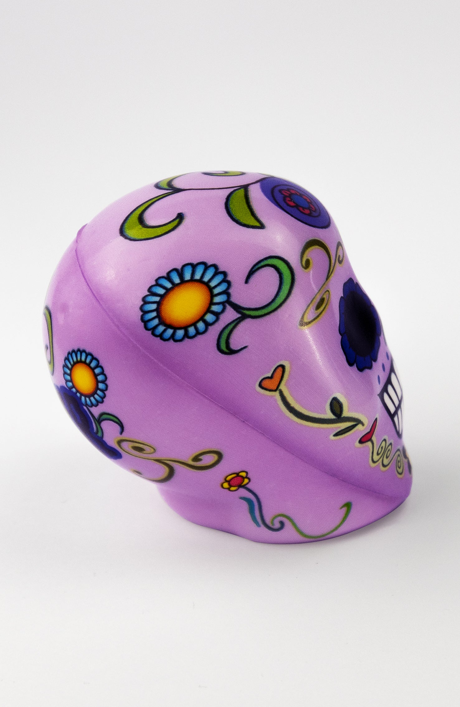 Pallina antistress a forma di teschio viola con decorazioni floreali