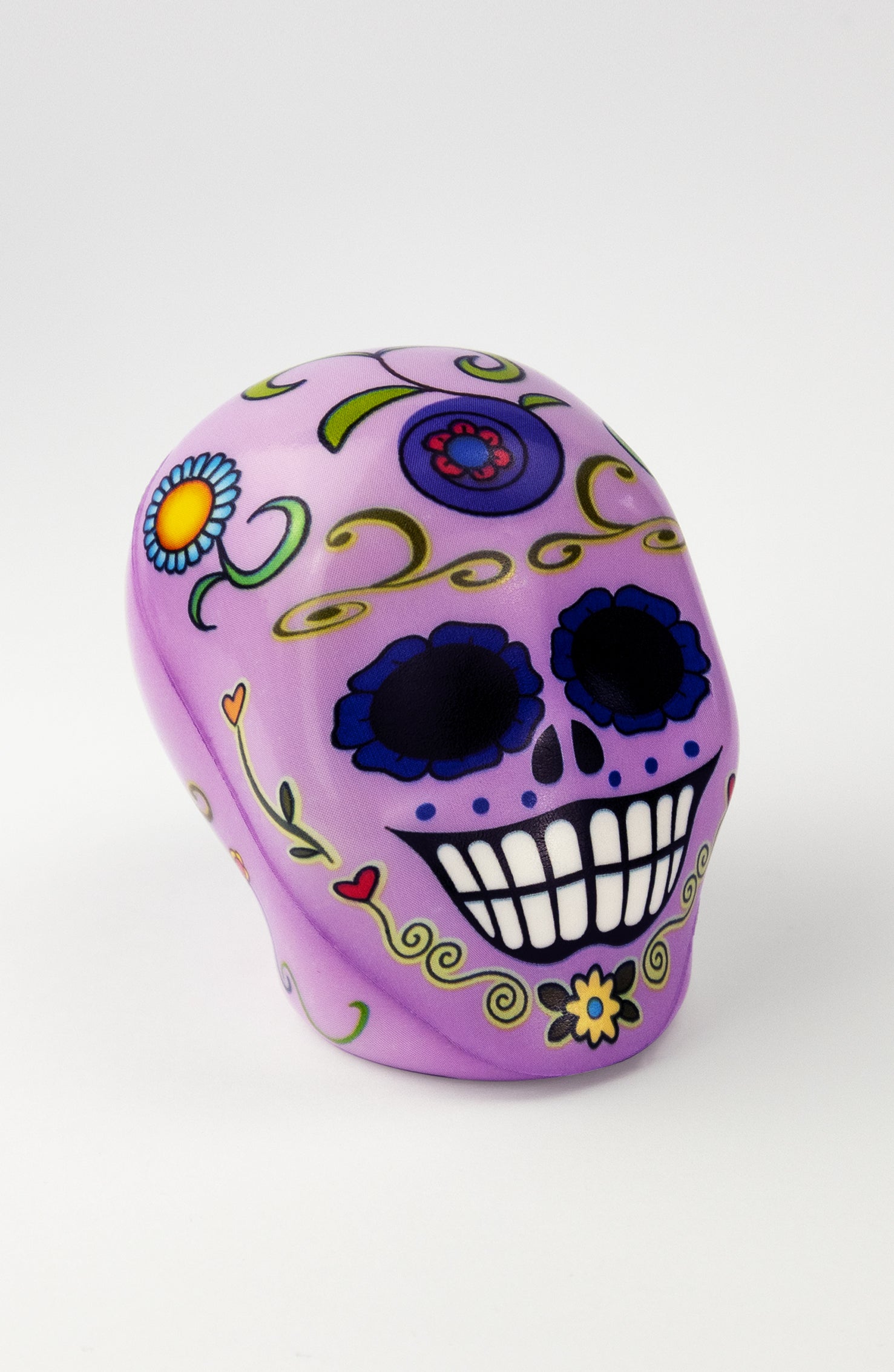 Pallina antistress a forma di teschio viola con decorazioni floreali