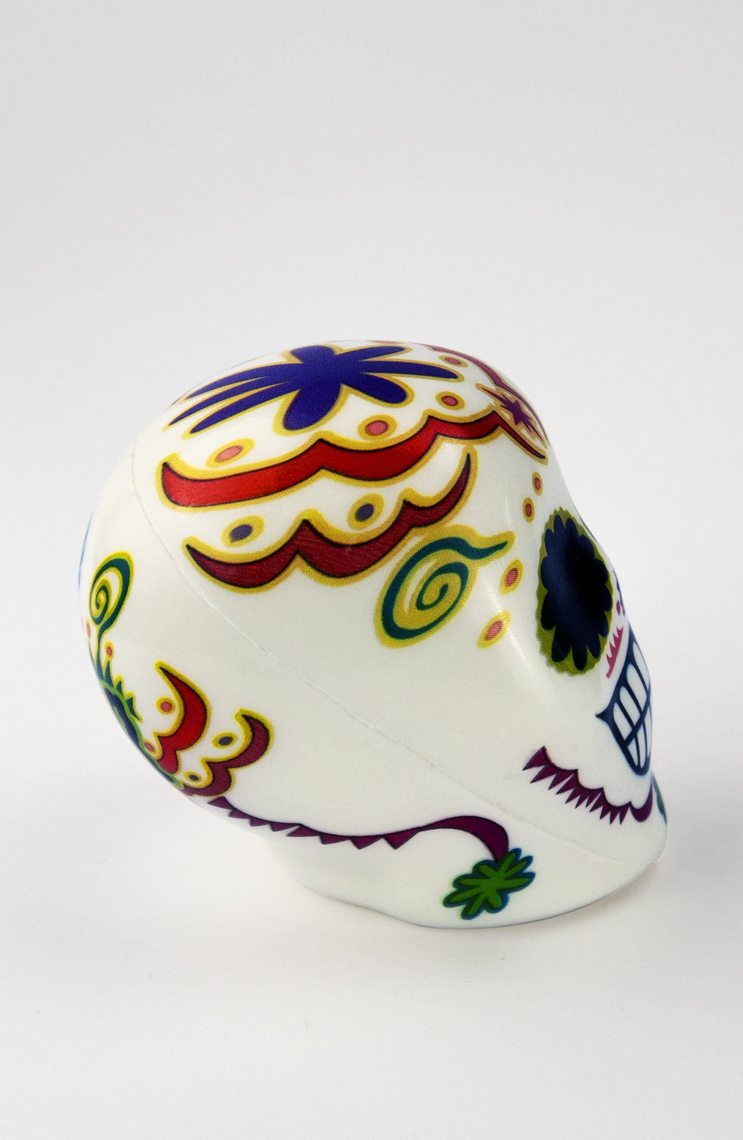 Pallina Antistress a forma di teschio bianco con decorazioni floreali