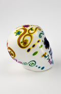 Pallina Antistress a forma di teschio bianco con decorazioni floreali multicolor