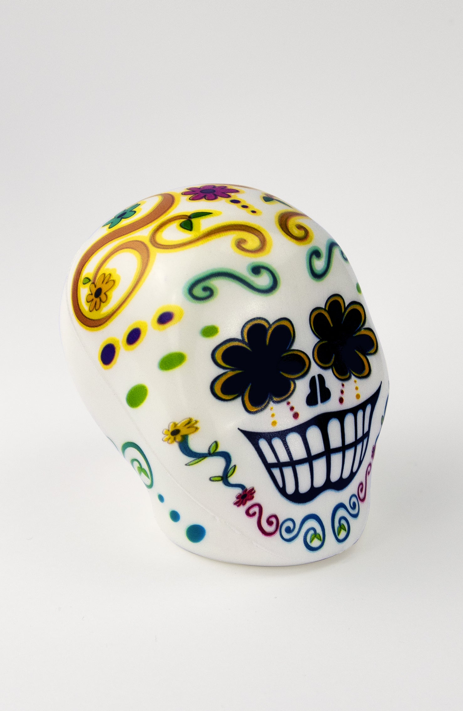 Pallina Antistress a forma di teschio bianco con decorazioni floreali multicolor