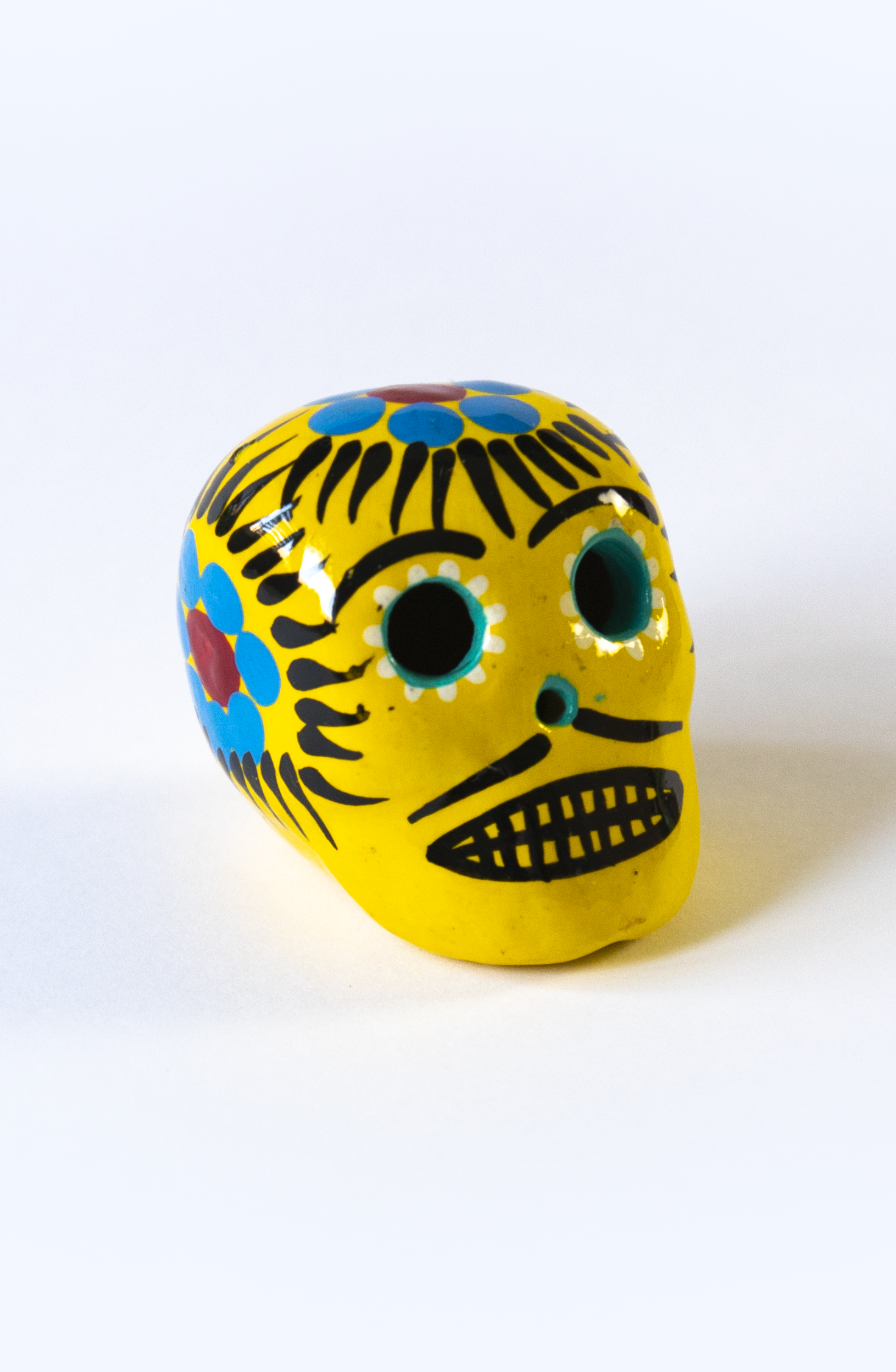 Teschio Calavera giallo con decorazioni floreali